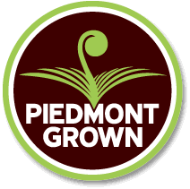 Luke+Beam+-+piedmontgrown Piedmont Grown logo featuring a green sprout design on a maroon background, promoting locally sourced agricultural products from the Piedmont region.